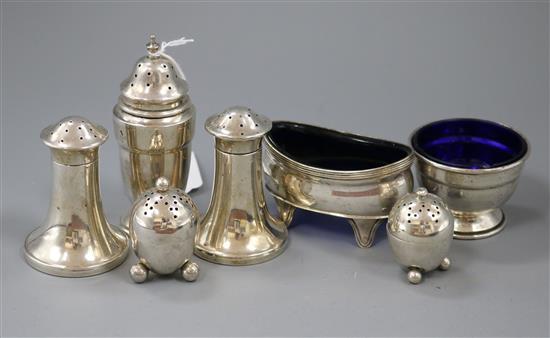 Two pairs of silver pepper pots, a single pepper pot and two salts.